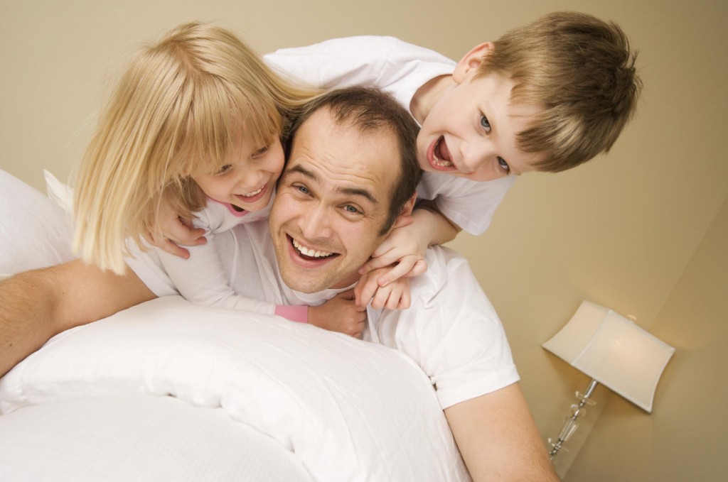 father-with-two-kids-playing